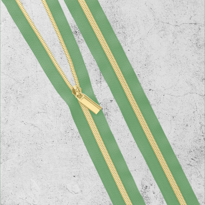 #5 Nylon Coil Zipper Green/Gold - PER QUARTER METRE #5 Nylon Coil Zipper Green/Gold - PER QUARTER METRE